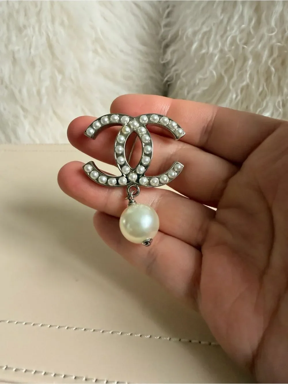 CHANEL brooch showcasing